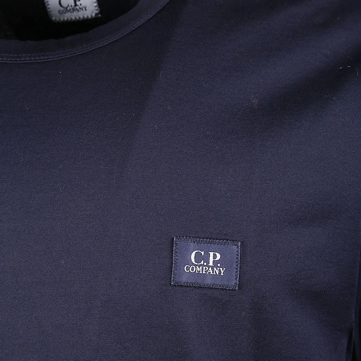 C.P. Company Jersey Logo Patch T-ShirtT-ShirtC.P. CompanyDPUS Designer Outlet7622792399402NavySC.P. Company Jersey Logo Patch T-Shirt