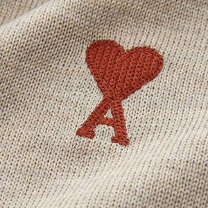 Ami Paris De Coer Red Heart Knitted Sweater in BeigeKnitwearAMI ParisDPUSXSAmi Paris De Coer Red Heart Knitted Sweater in Beige