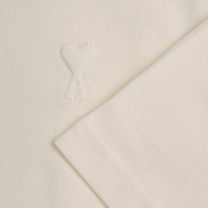 [Ami Paris] Small Embossed Ami De Coeur TshirtT-ShirtsAmi ParisDPUS Designer Outlet3666598751969Creamy WhiteXS[Ami Paris] Small Embossed Ami De Coeur Tshirt