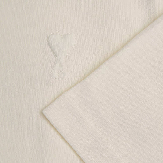 [Ami Paris] Small Embossed Ami De Coeur TshirtT-ShirtsAmi ParisDPUS Designer Outlet3666598751969Creamy WhiteXS[Ami Paris] Small Embossed Ami De Coeur Tshirt