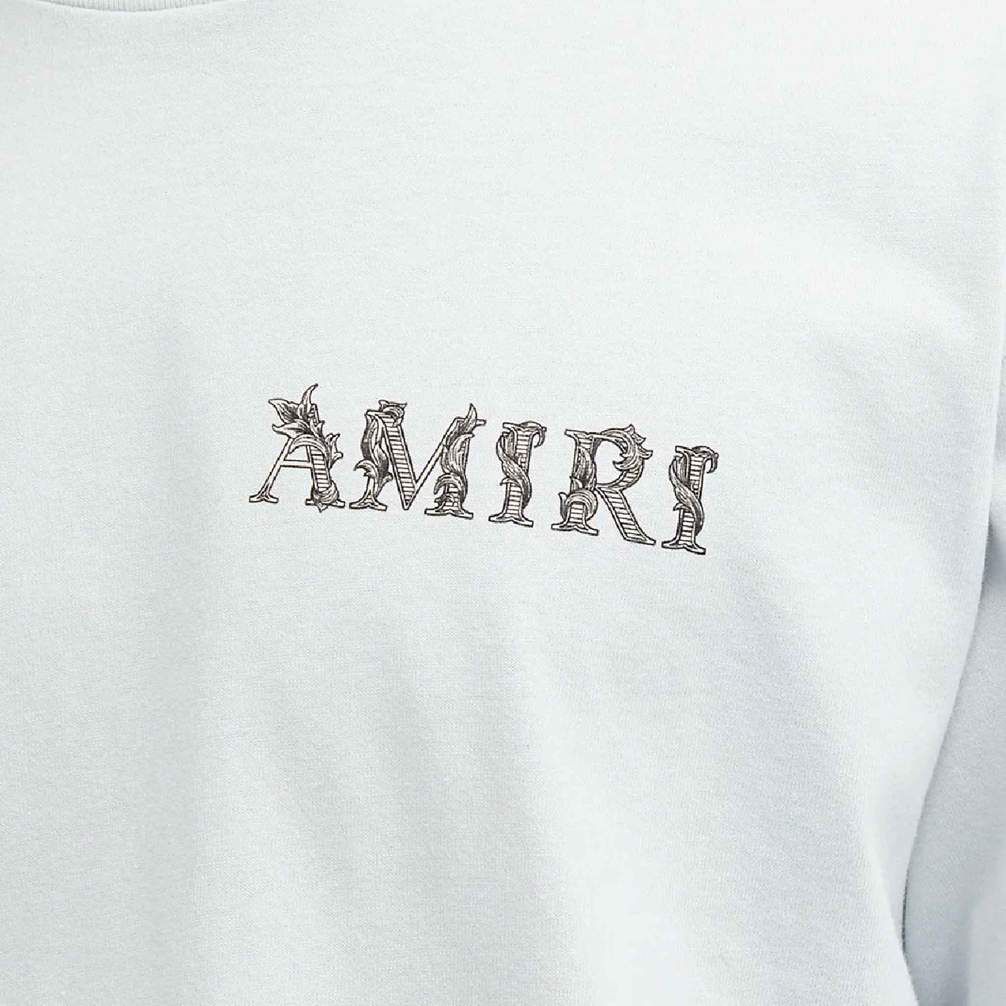 Amiri Baroque Logo T-Shirt in Gray DawnT-ShirtsAmiriDPUS191846552867SAmiri Baroque Logo T-Shirt in Gray Dawn