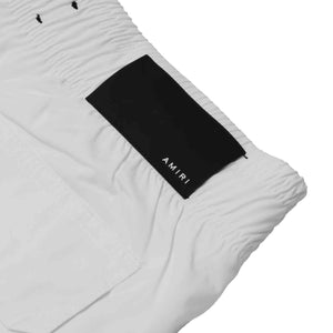 Amiri MA Bar Logo Swim Trunks in WhiteShortsAmiriDPUSXSAmiri MA Bar Logo Swim Trunks in White