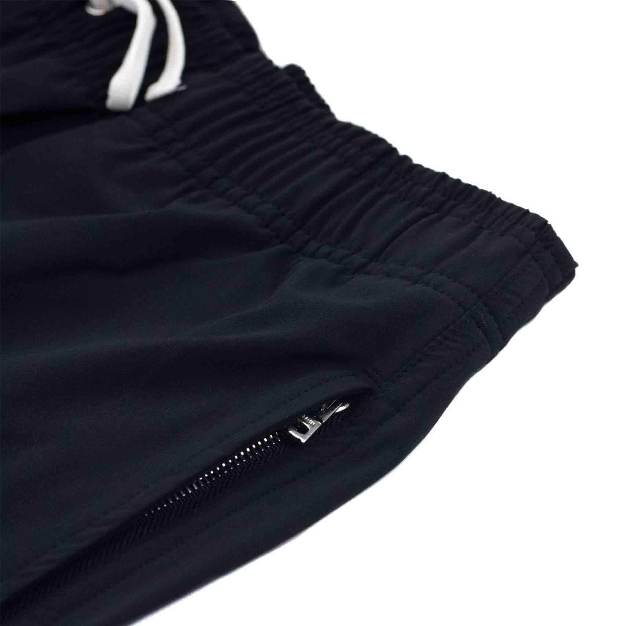 Amiri Vertical Logo Swim Trunks in BlackShortsAmiriDPUSXSAmiri Vertical Logo Swim Trunks in Black