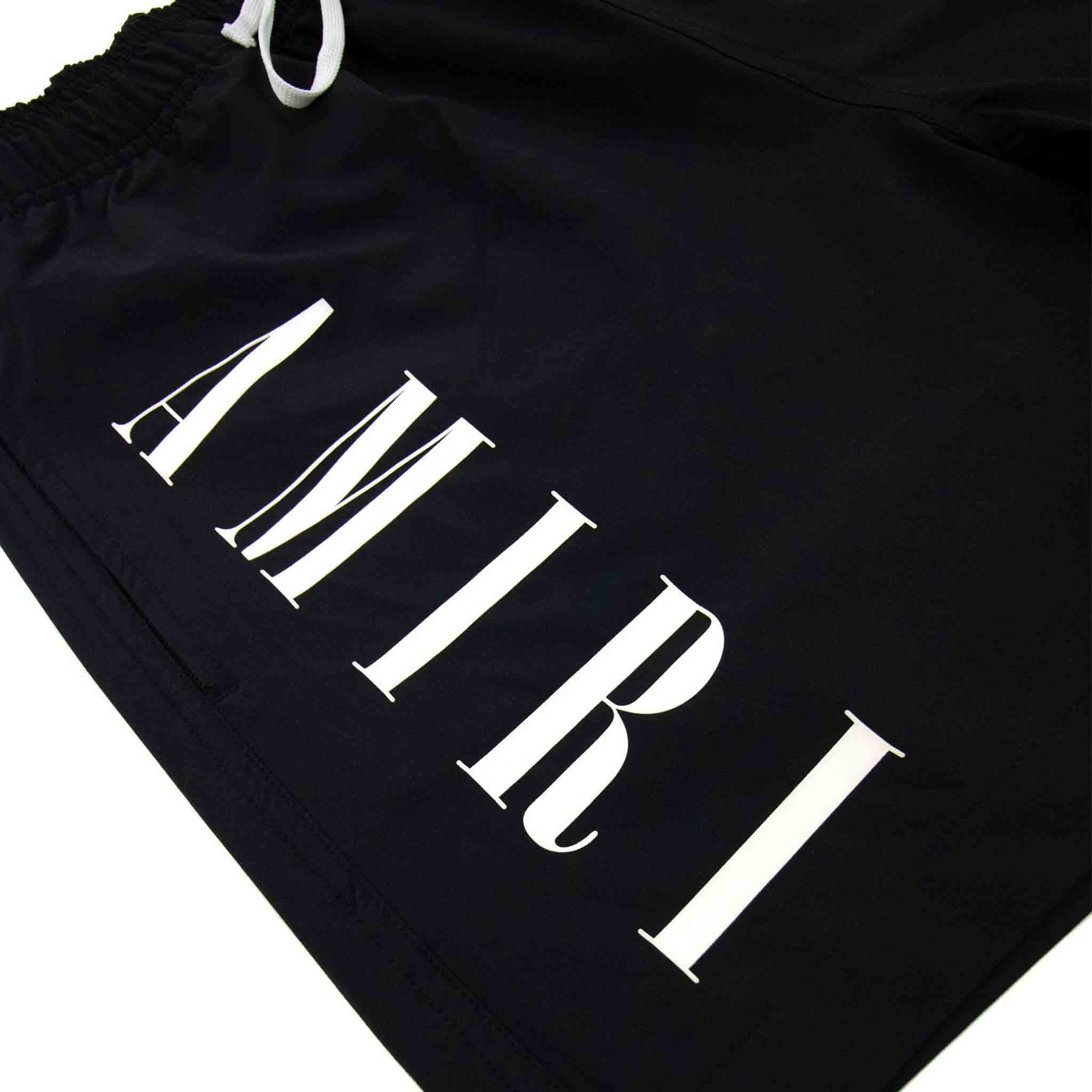 Amiri Vertical Logo Swim Trunks in BlackShortsAmiriDPUSXSAmiri Vertical Logo Swim Trunks in Black