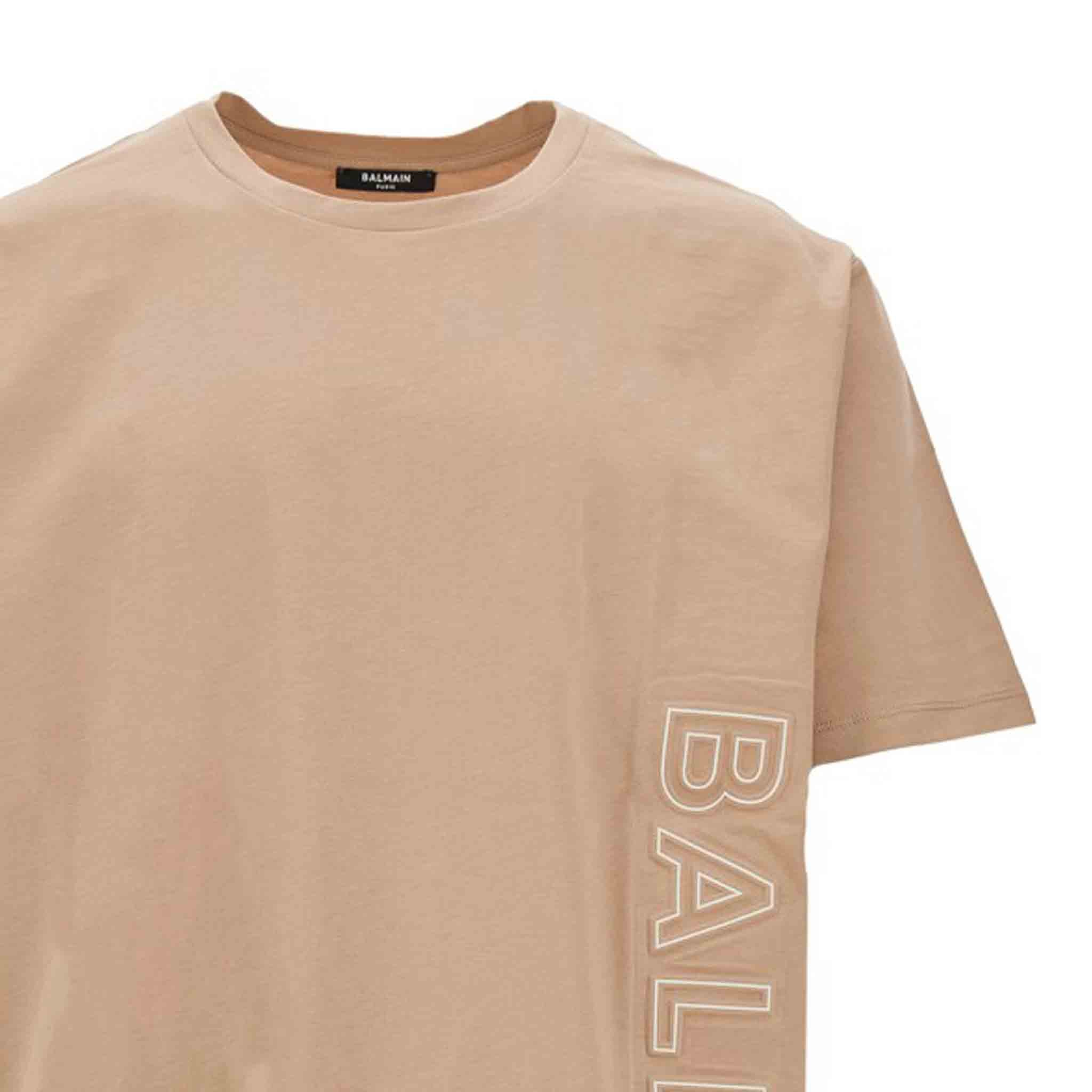 Balmain Logo Embossed T-Shirt in BeigeT-ShirtsBalmainDPUSSBalmain Logo Embossed T-Shirt in Beige