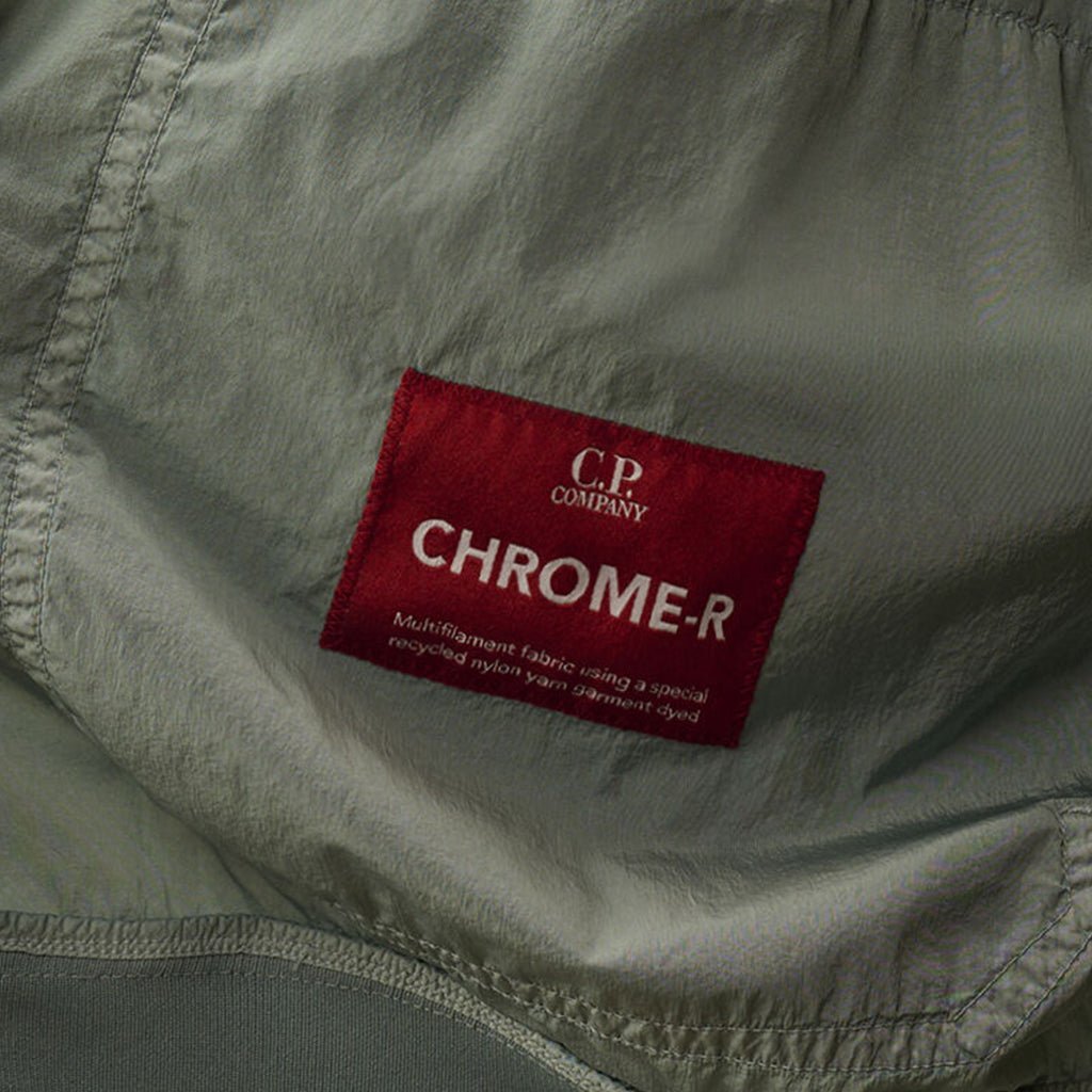 [C.P. Company] Chrome - R Button Bomber JacketCoats & JacketsC.P. CompanyDPUS Designer Outlet7622792611825Silver BlueS[C.P. Company] Chrome - R Button Bomber Jacket