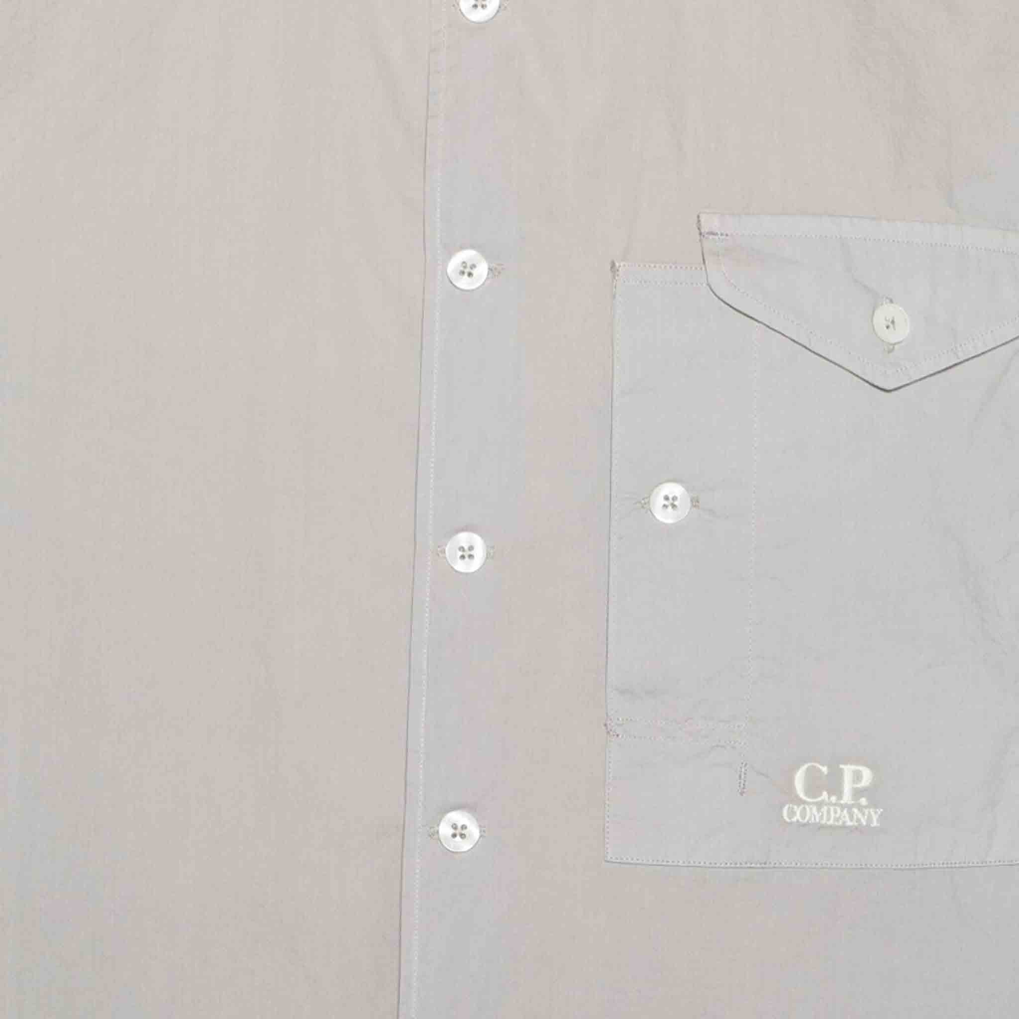 C.P. Company Cotton Popeline Short Sleeved Shirt in Drizzle GreyShirtsC.P. CompanyDPUS7620943811636SC.P. Company Cotton Popeline Short Sleeved Shirt in Drizzle Grey