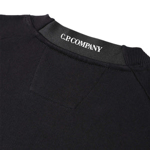 C.P. Company Diagonal Raised Fleece Crew Neck Lens Sweatshirt in BlackSweatshirtsC.P. CompanyDPUS7620943900903SC.P. Company Diagonal Raised Fleece Crew Neck Lens Sweatshirt in Black