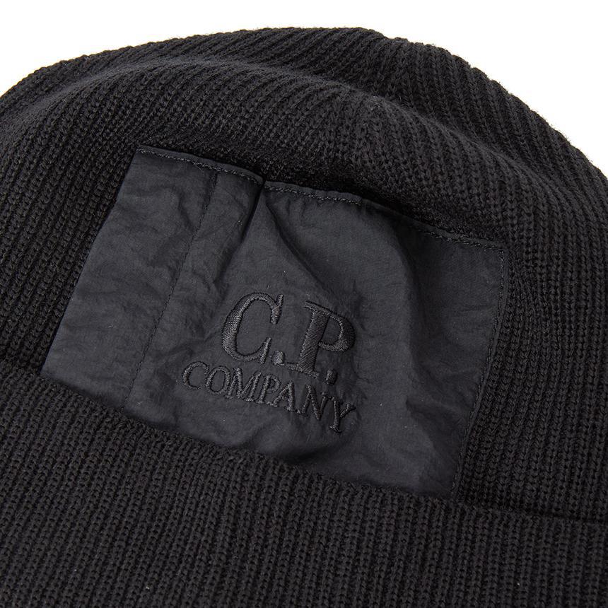 C.P. Company Extra fine Merino Wool Pocket Beanie in BlackCaps & HatsC.P. CompanyDPUS Designer Outlet7622792406766UNIC.P. Company Extra fine Merino Wool Pocket Beanie in Black