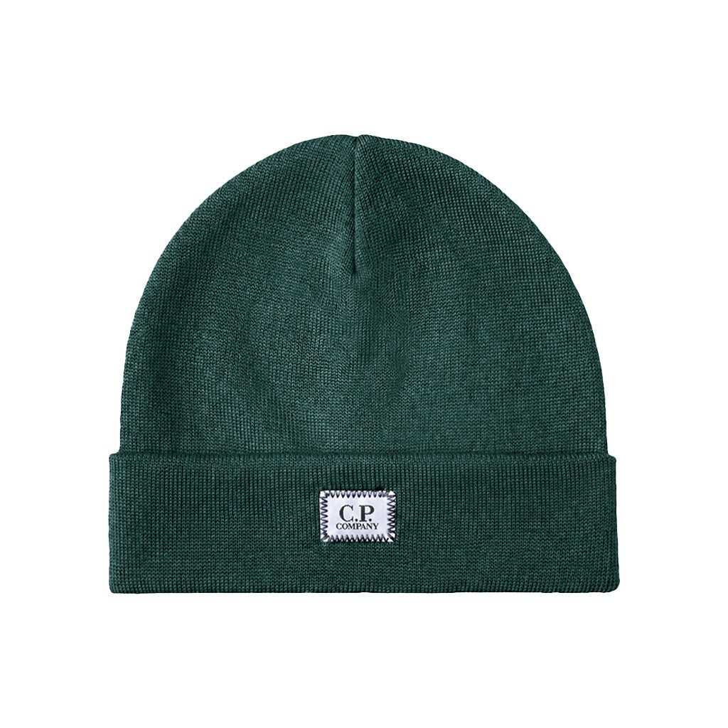 [C.P. Company] Extrafine Merino Wool Logo Label BeanieCaps & HatsC.P. CompanyDPUS Designer Outlet21CMAC138A-005509A-592AndorraUNI[C.P. Company] Extrafine Merino Wool Logo Label Beanie