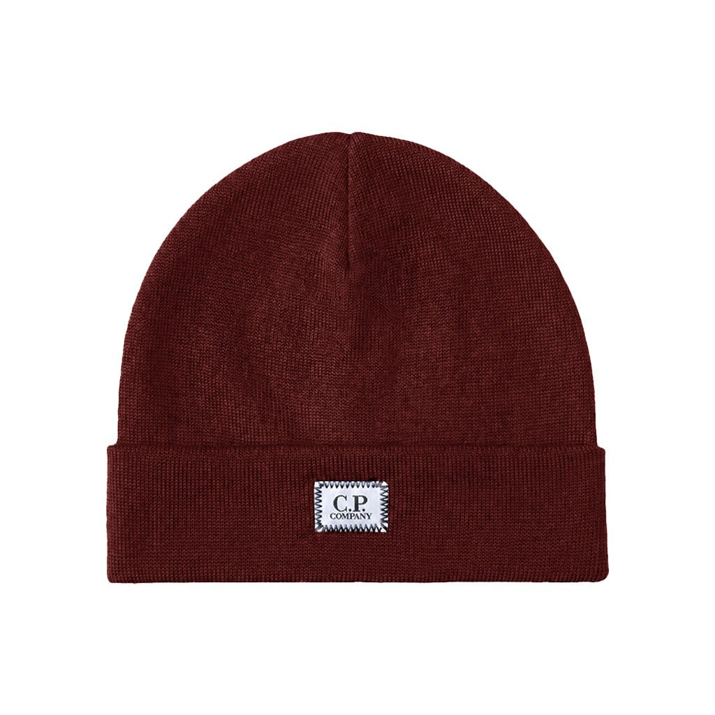 [C.P. Company] Extrafine Merino Wool Logo Label BeanieCaps & HatsC.P. CompanyDPUS Designer Outlet21CMAC138A-005509A-697Ponderosa PineUNI[C.P. Company] Extrafine Merino Wool Logo Label Beanie