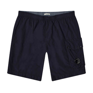 C.P. Company Flatt Nylon Cargo Swimshorts in Total Eclipse - NavyShortsC.P. CompanyDPUS44C.P. Company Flatt Nylon Cargo Swimshorts in Total Eclipse - Navy