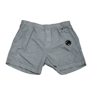 C.P. Company Flatt Nylon Utility Lens Swimshorts in Limestone - GreyShortsC.P. CompanyDPUS Designer Outlet762279229065546C.P. Company Flatt Nylon Utility Lens Swimshorts in Limestone - Grey