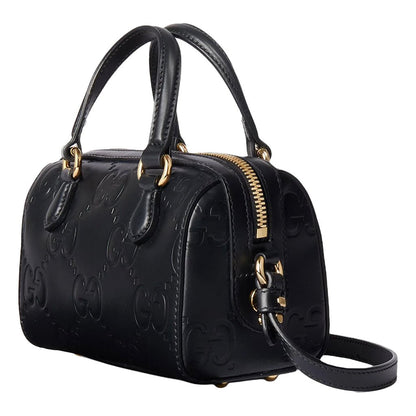 Gucci GG Embossed Leather Small Boston BagBagsGucciDPUS Designer Outlet790130-10008135308707BlackGucci GG embossed black leather small Boston bag side view showing gold hardware, zipper, and shoulder strap.