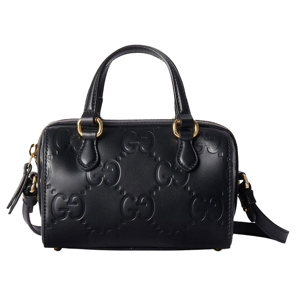 Gucci GG Embossed Leather Small Boston BagBagsGucciDPUS Designer Outlet790130-10008135308707BlackGucci GG embossed black leather small Boston bag front view with top handles, shoulder strap and gold hardware.