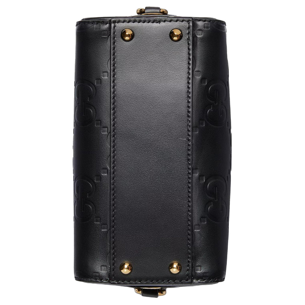 Gucci GG Embossed Leather Small Boston BagBagsGucciDPUS Designer Outlet790130-10008135308707BlackGucci GG embossed black leather small Boston bag bottom view showing four gold-tone metal feet and monogram pattern.