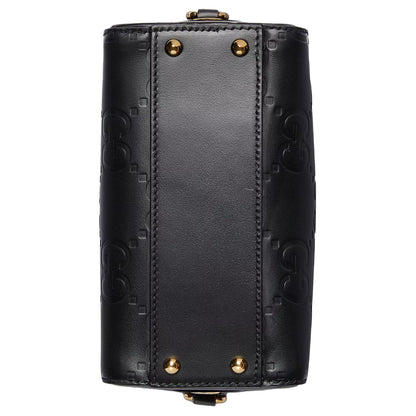 Gucci GG Embossed Leather Small Boston BagBagsGucciDPUS Designer Outlet790130-10008135308707BlackGucci GG embossed black leather small Boston bag bottom view showing four gold-tone metal feet and monogram pattern.