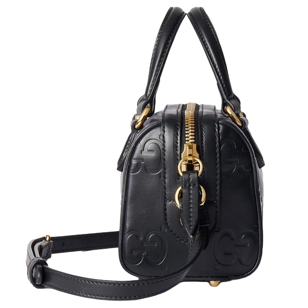 Gucci GG Embossed Leather Small Boston BagBagsGucciDPUS Designer Outlet790130-10008135308707BlackGucci GG embossed black leather small Boston bag side profile showing gold zipper and top handle.