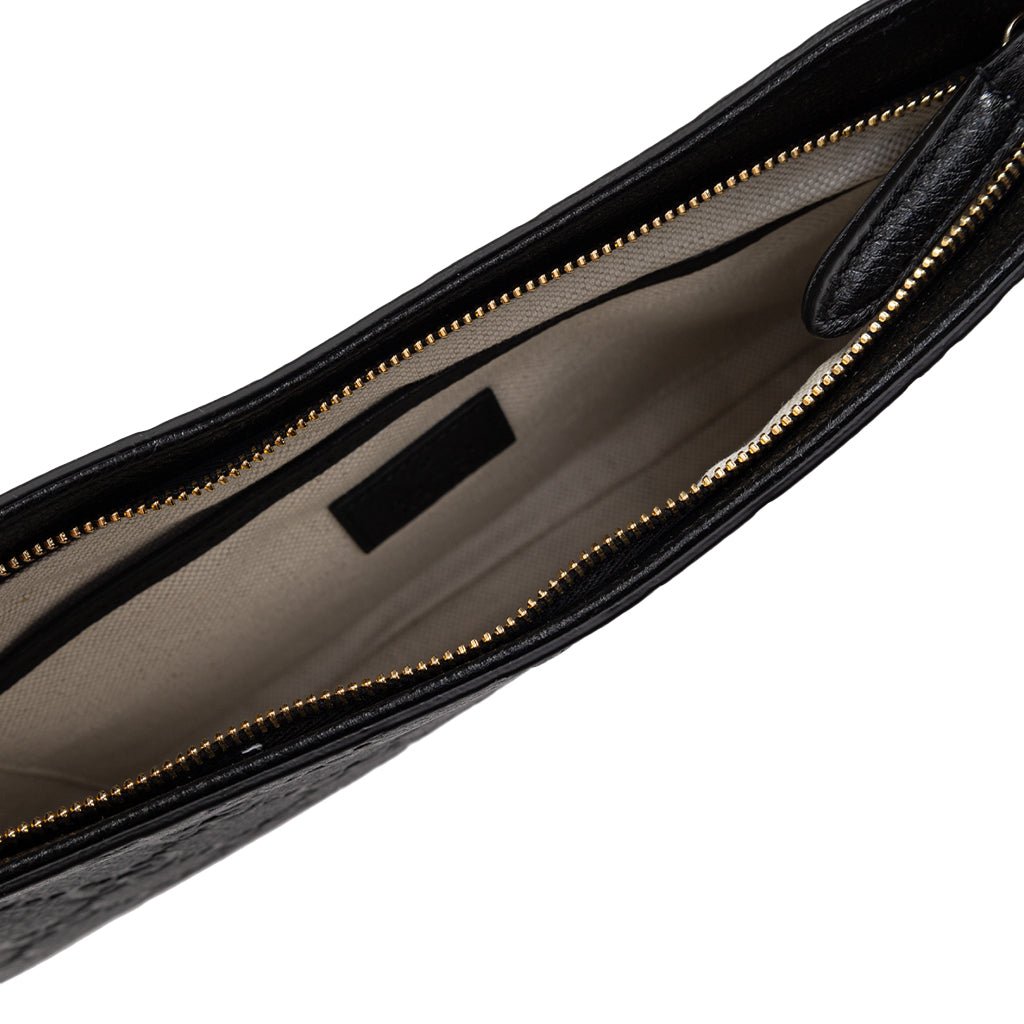 Gucci GG Leather Shoulder BagBagsGucciDPUS Designer Outlet815277-10008137462274BlackInterior of Gucci GG embossed black leather shoulder bag with beige lining and gold-tone zipper.