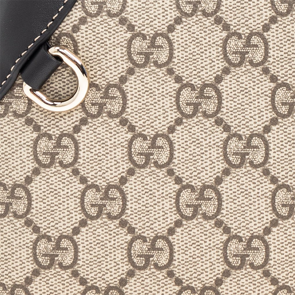 Gucci GG Monogram Shoulder BagBagsGucciDPUS Designer Outlet815218-97658137135656BlackClose-up of Gucci GG Supreme canvas shoulder bag with black leather trim and gold hardware D-ring.