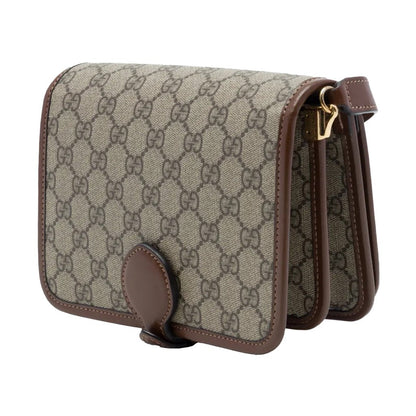 Gucci GG Supreme Monogram Crossbody Shoulder BagBagsGucciDPUS Designer Outlet671620-85638101485227BrownGucci GG Supreme canvas crossbody bag side view with brown leather trim, accordion compartments and gold-tone hardware.