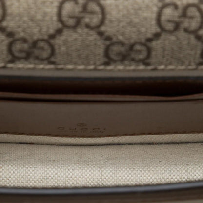Gucci GG Supreme Monogram Crossbody Shoulder BagBagsGucciDPUS Designer Outlet671620-85638101485227BrownInterior close-up of Gucci GG Supreme canvas crossbody bag showing light beige lining and embossed Gucci logo.