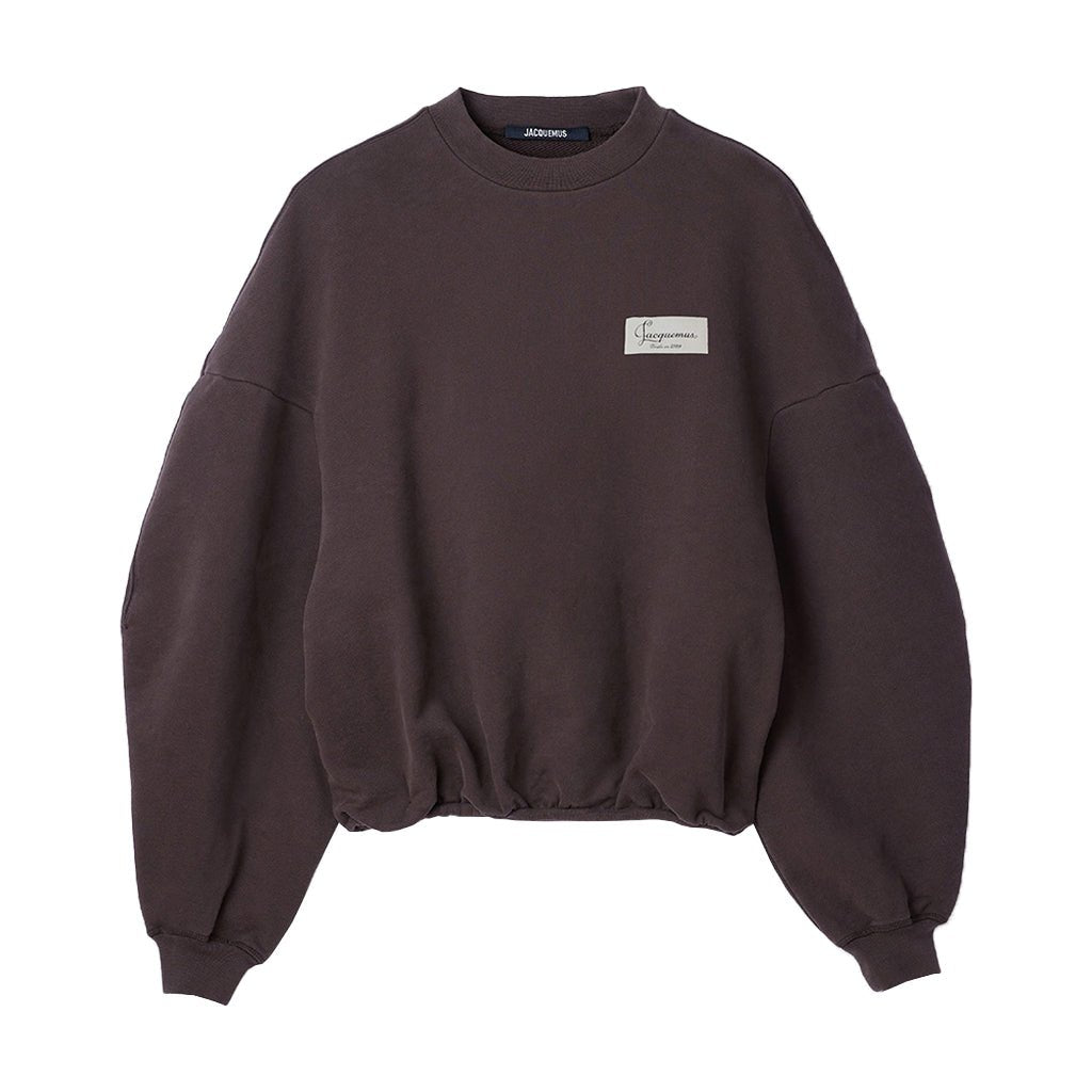 [Jacquemus] The Montaigne SweatshirtSweatshirtsJacquemusDPUS Designer OutletSSU00215AJ00325-881-S3667567036094Dark BrownS[Jacquemus] The Montaigne Sweatshirt