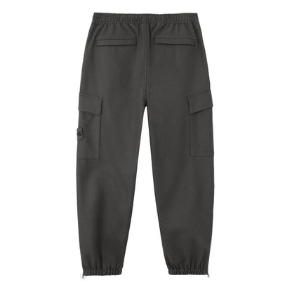 Stone Island Ghost Flannel Loose Fit Trousers with Elasticated Zipped Cuffs in Dark GreyTrousersStone IslandDPUS Designer Outlet805381348634128Stone Island Ghost Flannel Loose Fit Trousers with Elasticated Zipped Cuffs in Dark Grey