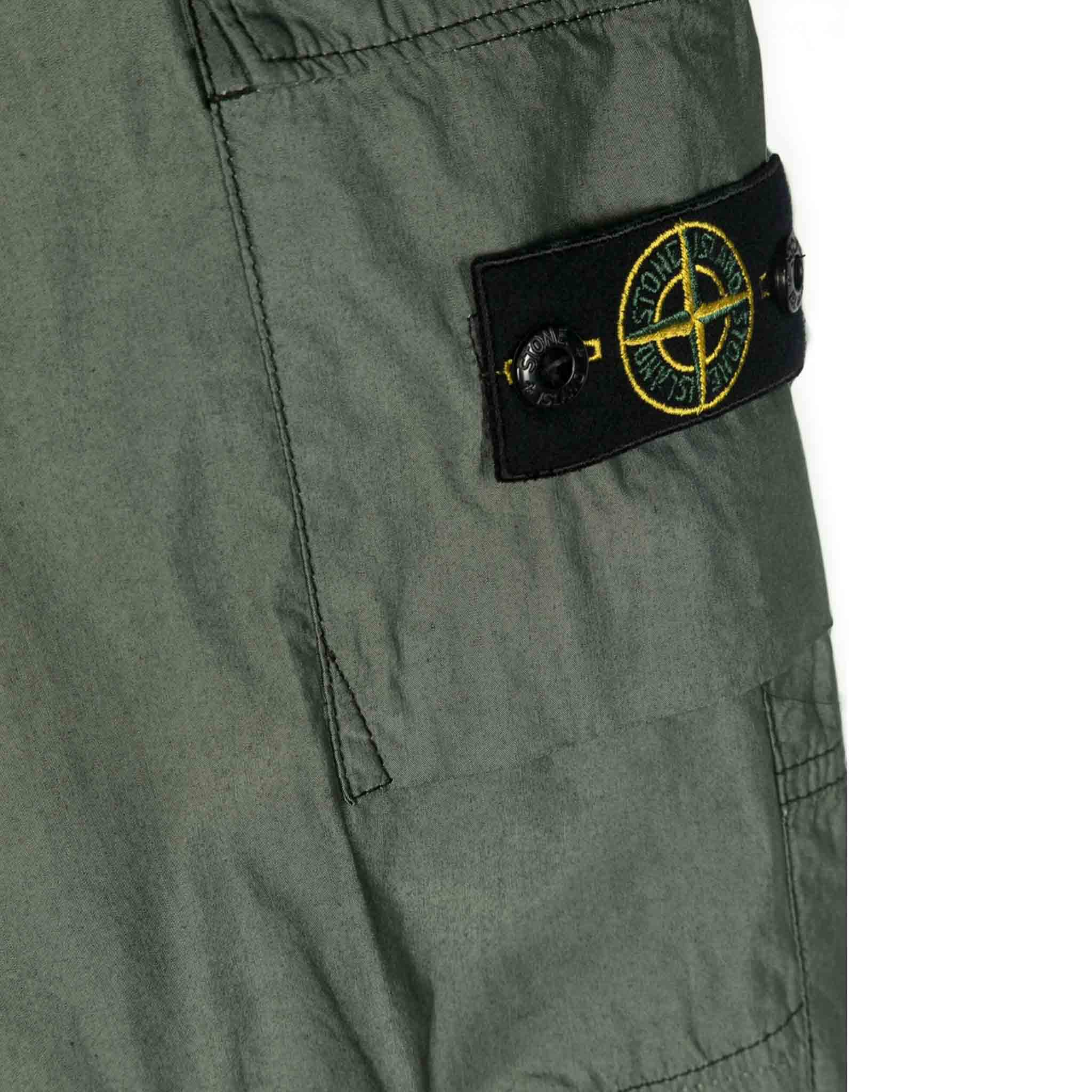 Stone Island Junior Cotton/ Polyester Cargo Trousers in Olive GreenTrousersStone Island JuniorDPUS80525728673098Stone Island Junior Cotton/ Polyester Cargo Trousers in Olive Green