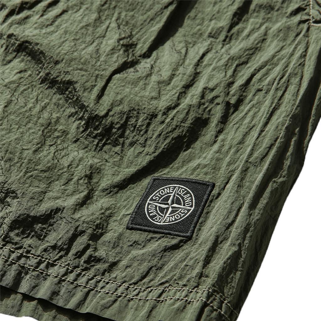 Stone Island Nylon Metal In Econyl® Regenerated Nylon, Garment Dyed ShortsShortsStone IslandDPUS Designer Outlet015494171747Military GreenXLStone Island Nylon Metal In Econyl® Regenerated Nylon, Garment Dyed Shorts