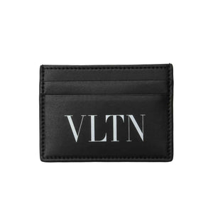 This stylish Valentino cardholder is made of durable black leather and features a VLTN logo printed in white on the front. It has a debossed logo and three card slots and a central pocket to keep your cards and cash organised. The cardholder is lined with viscose 100% and is made of bovine split leather 100%. This cardholder is a practical and fashionable accessory for everyday use.