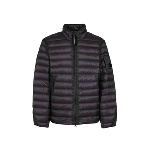 A contemporary take on the classic down jacket, with an adjustable hem, C.P. Company Lens detail on the sleeve pocket and characteristic kangaroo pockets on the front. The D.D. Shell Ripstop range uses an opaque seven denier nylon outer shell and this finer uncoated nylon, coupled with the Direct Down injection process, makes the garment even softer and emphasises the motivation for the continued use of down garments.