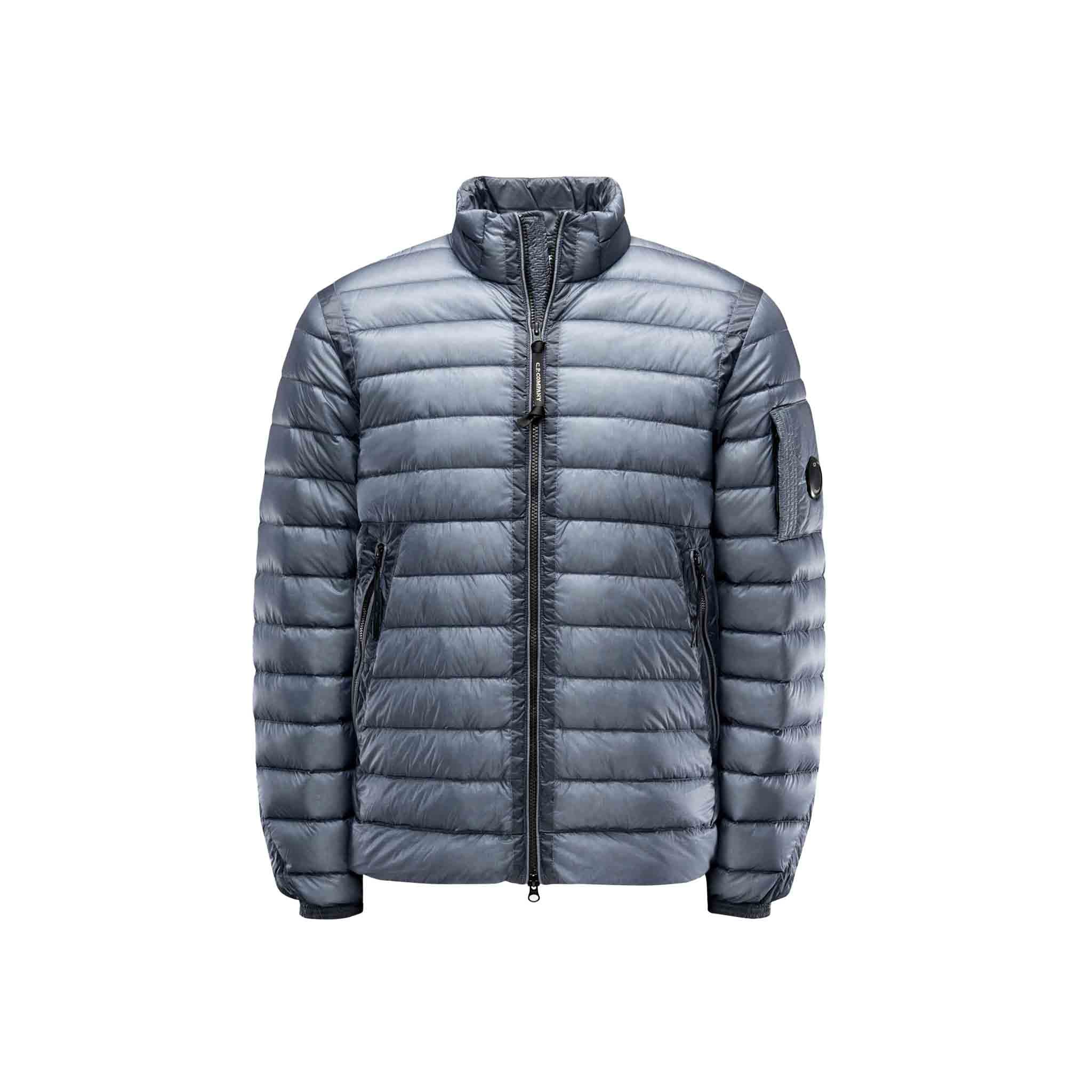 A contemporary take on the classic down jacket, with an adjustable hem, C.P. Company Lens detail on the sleeve pocket and characteristic kangaroo pockets on the front. The D.D. Shell Ripstop range uses an opaque seven denier nylon outer shell and this finer uncoated nylon, coupled with the Direct Down injection process, makes the garment even softer and emphasises the motivation for the continued use of down garments.