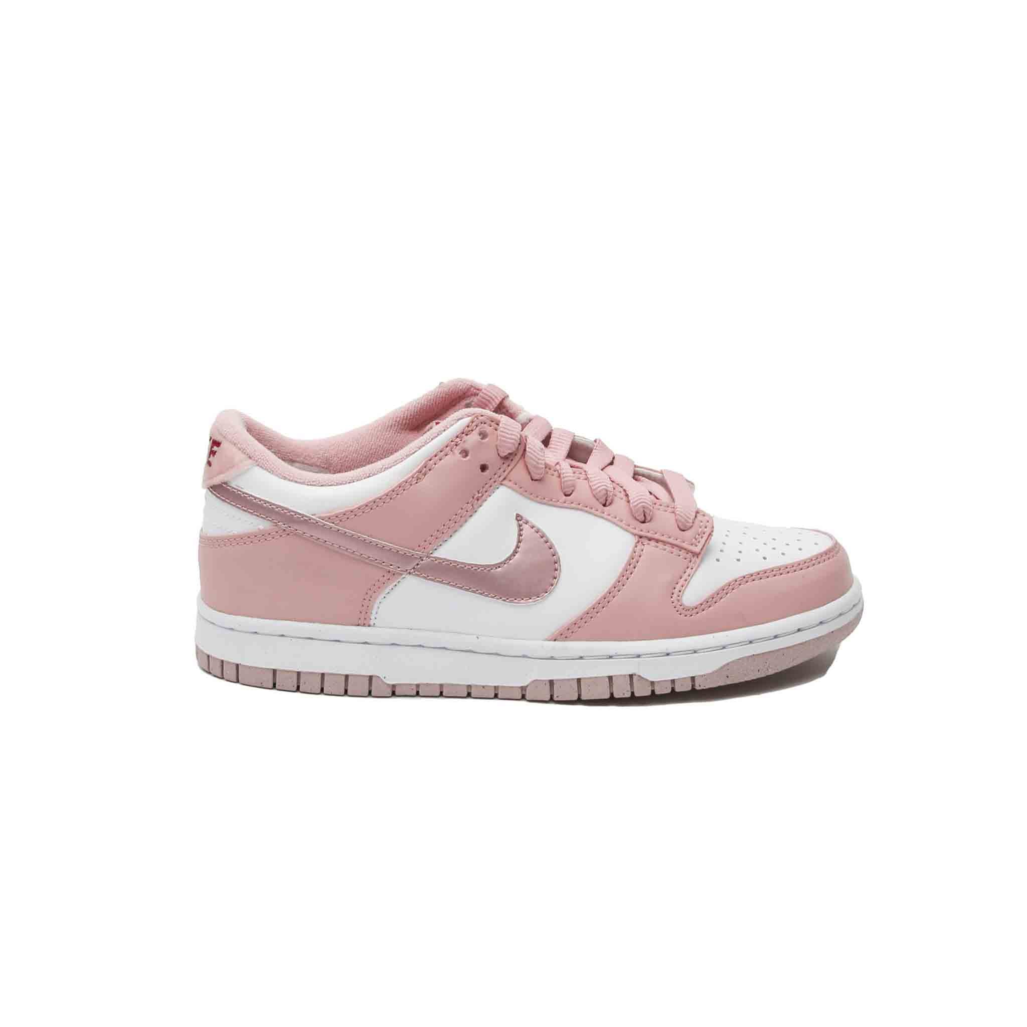 The Nike Dunk Low is a stylish, high-performance sneaker that is perfect for casual wear. The pink and white leather uppers give this shoe a bold, eye-catching look, while the velvet tab at the back adds a touch of luxury. The rubber sole provides traction and durability, making this shoe a practical choice for any woman on the go. Whether paired with jeans or leggings, this sneaker is sure to become a go-to favourite.