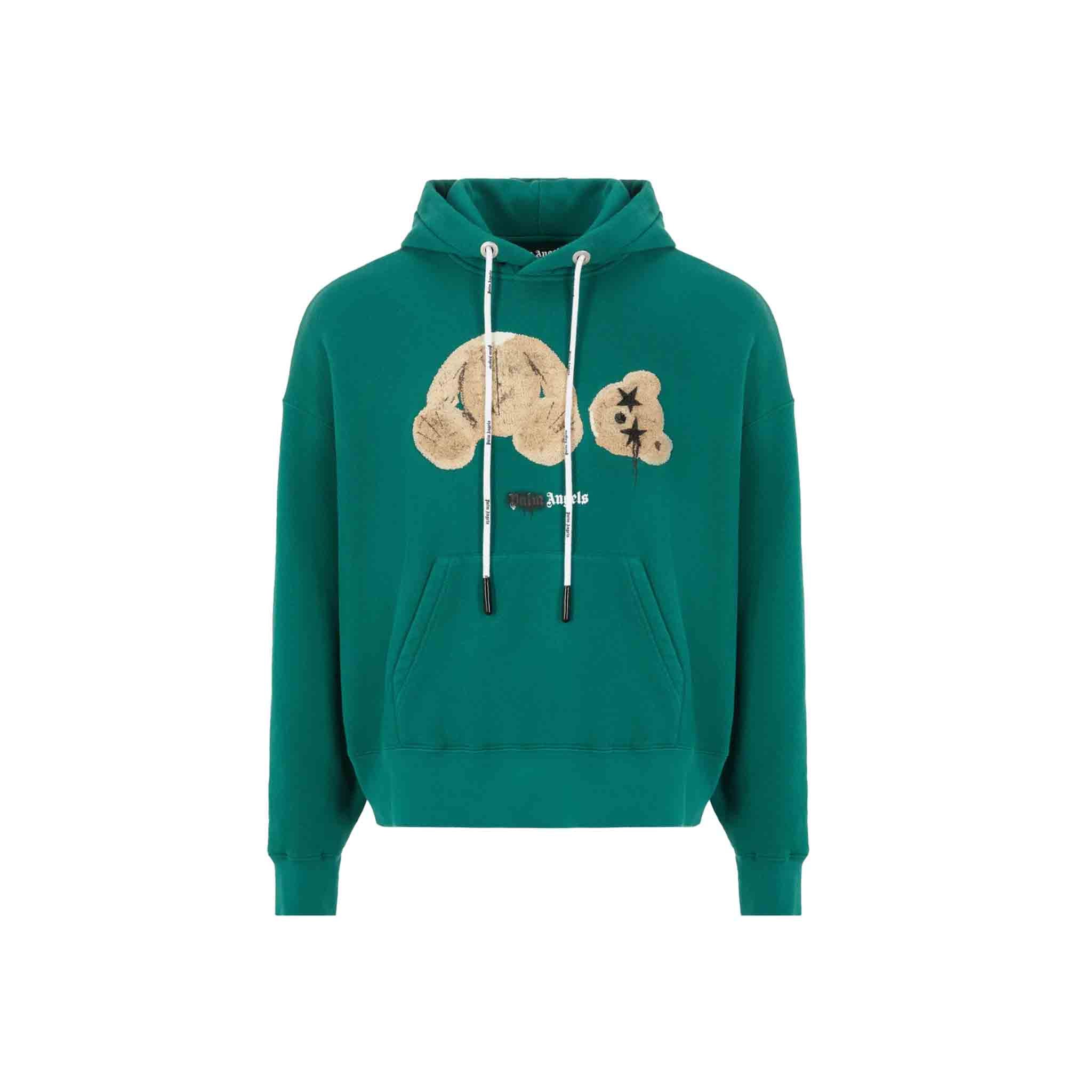 This Palm Angels hooded sweatshirt features a bear graphic embroidered on the front, with a sprayed Palm Angels logo printed below. The sweatshirt also has a kangaroo pocket and logo drawstrings. It has an oversize fit for a relaxed and comfortable wear. Made from a soft and durable cotton material, this sweatshirt is perfect for keeping warm on cool days.