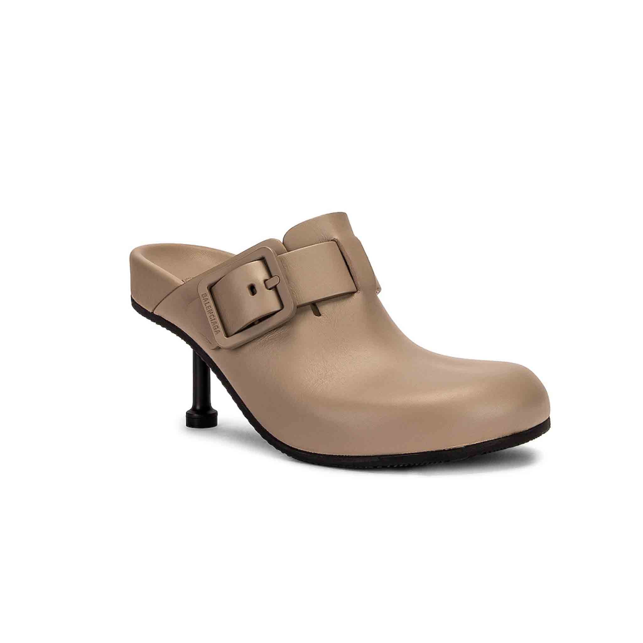 Balenciaga Mallorca MuleShoesBalenciagaDPUS Designer Outlet4433200736Elevate your shoe collection with these chic Mallorca mules from Balenciaga. The natural leather is stylish and wearable, while the tonal buckle embellishments add a touch of drama. The round toe and slip - on style make them easy to wear, and the 80mm stiletto heel gives you a little extra height. These mules are perfect for dressing up or dressing down.
